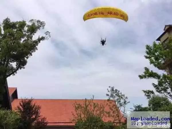 Lmao! Man who parachuted down to propose to girlfriend crashes into a tree (photos)